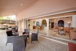 Slidding glass doors open to pool and beachside terrace